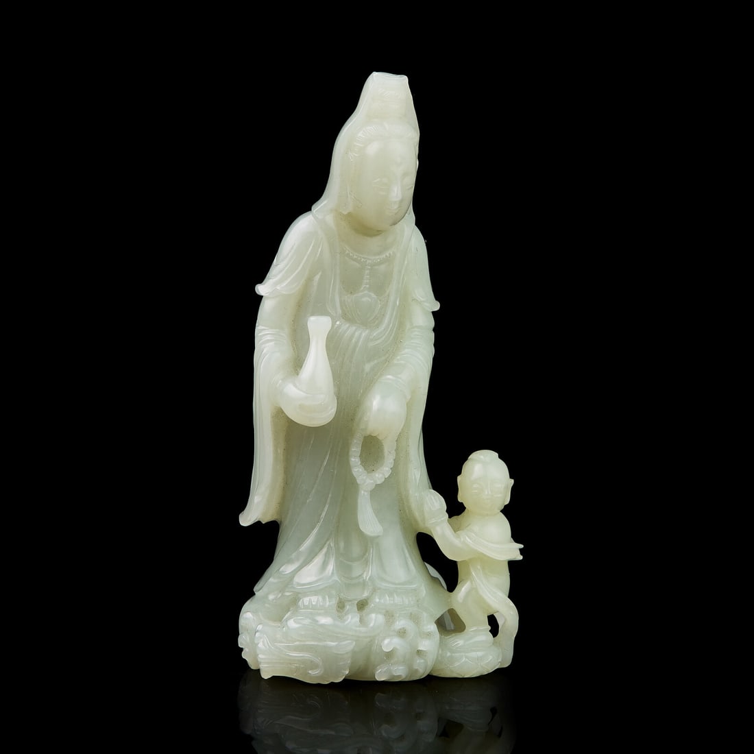 A Chinese Jade Figural Group of Guanyin and Boy 青白玉雕送子