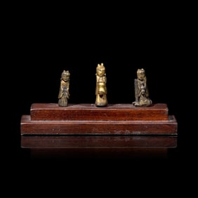 An Unusual Group of Three Chinese Gilt Bronze Miniature Deities, Ming Dynasty 明 銅