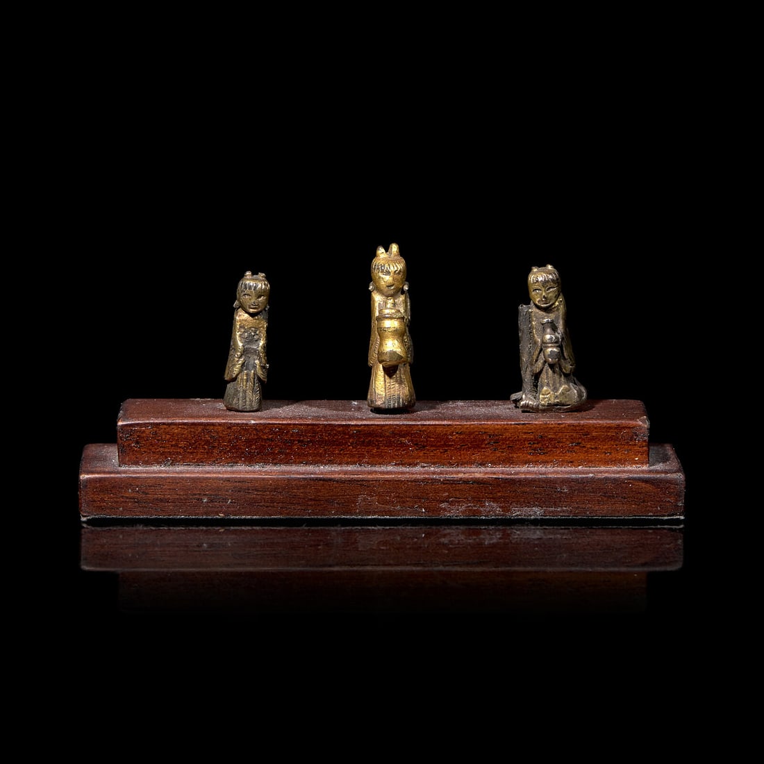 An Unusual Group of Three Chinese Gilt Bronze Miniature Deities, Ming Dynasty 明 銅