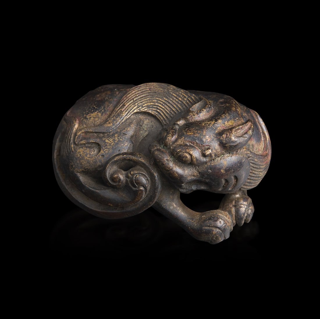 A Chinese Patinated Bronze Figure of a Stylized Lion, Late Ming-Early Qing Dynasty 晚明