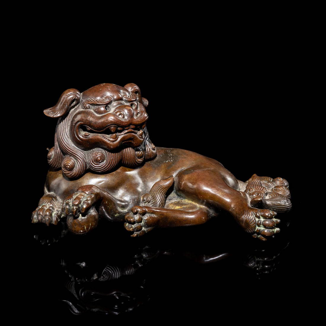 A Chinese Bronze Lion Incense Burner, 18th-19th Century 清 銅臥獅香