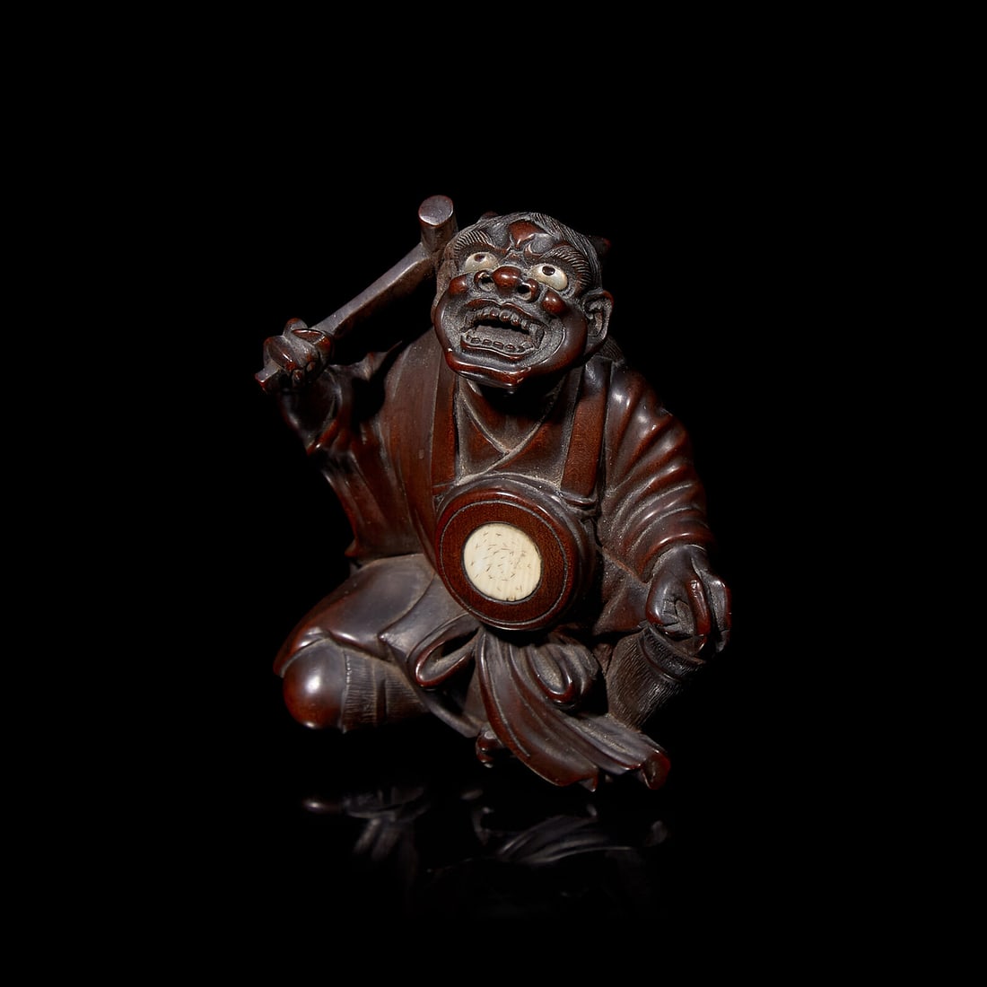 A Japanese Carved Boxwood \"Oni\" Okimono, Meiji Period