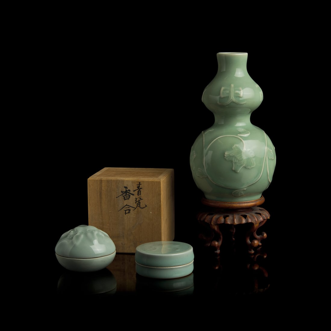 A Japanese Celadon-Glazed Double Gourd Vase, Seifu Yohei III, and Two Kogo, Suwa Sozan