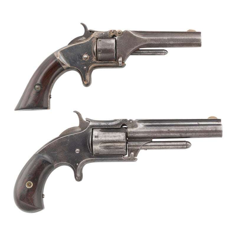 Smith & Wesson No. 1 Second Issue and Model 1 1/2 Second Issue Revolvers: Smith & Wesson No. 1 Second Issue and Model 1 1/2 Second Issue Revolvers 1.) .22 Short. 3.125" barrel length. SN: 99395. Blued metal finish with silver plated brass frame mounting varnished rosewo