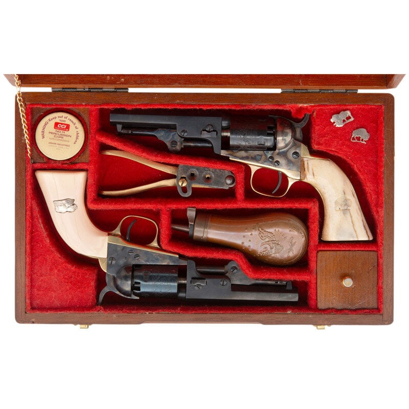 Cased Pair of Italian Reproduction Colt Model 1849 Pocket Revolvers with Accessories: Cased Pair of Italian Reproduction Colt Model 1849 Pocket Revolvers with Accessories 1.) .31 Cal. 4" barrel length. SN: 02002. Blued and casehardened metal finish with brass gripstraps mounting bone g