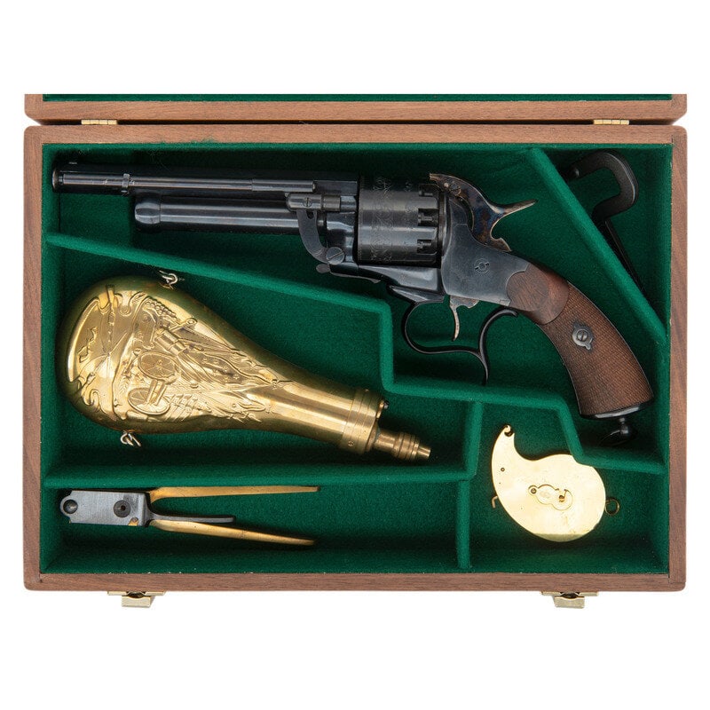 Cased Replica LeMat Revolver with Accessories by Pietta: Cased Replica LeMat Revolver with Accessories by Pietta .44 Cal./20 Gauge. 6.75" barrel length. SN: L15735. Blued and casehardened metal finish with checkered walnut two-piece grips. Single action nin