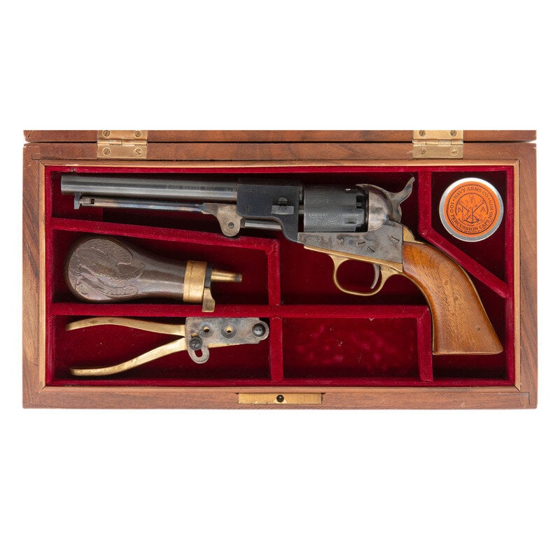 Cased Replica Italian Colt 1849 Pocket Revolver: Cased Replica Italian Colt 1849 Pocket Revolver .31 Cal. 5.75" barrel length. SN: 2519. Blued and casehardened metal finish with brass gripstraps mounting one piece walnut grips. Single action five-sh