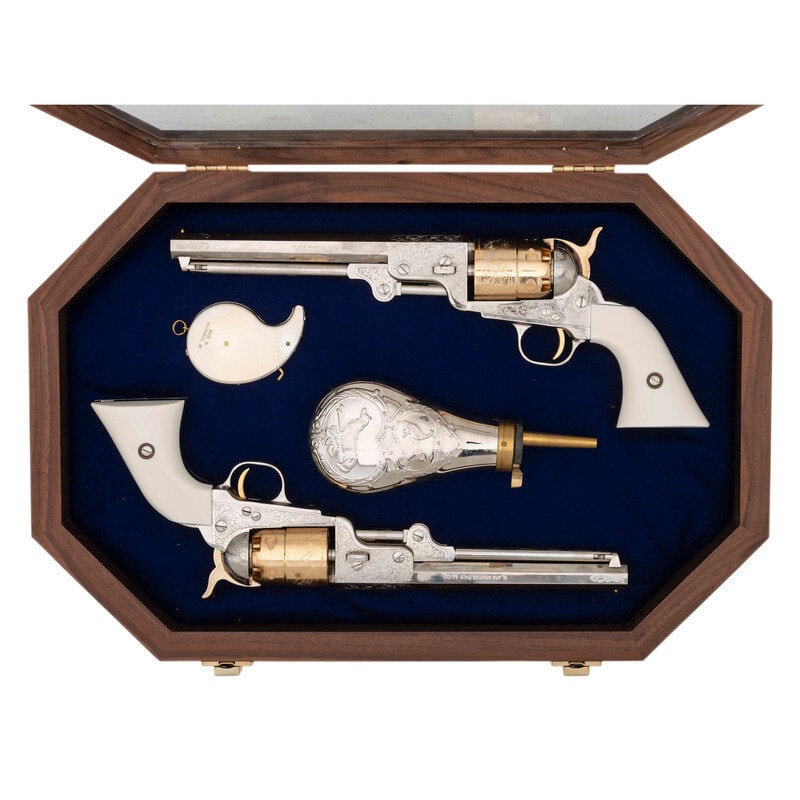 Display Cased Pair of Pietta .44 Caliber Plated & Engraved Reproduction Colt 1851 Navy Type Percussi: Display Cased Pair of Pietta .44 Caliber Plated & Engraved Reproduction Colt 1851 Navy Type Percussion Revolvers 1.) .44 Cal. 7.375" barrel length. SN: 552078. Nickel plated finish with gold finis