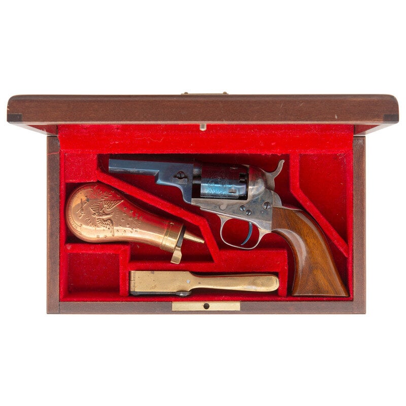 Uberti Wells Fargo Reproduction Commemorative Baby Dragoon Revolver in Box: Uberti Wells Fargo Reproduction Commemorative Baby Dragoon Revolver in Box .31 Cal. 3" barrel length. SN: 0794. Blued and casehardened finish with silver plated gripstraps and varnished walnut one pie
