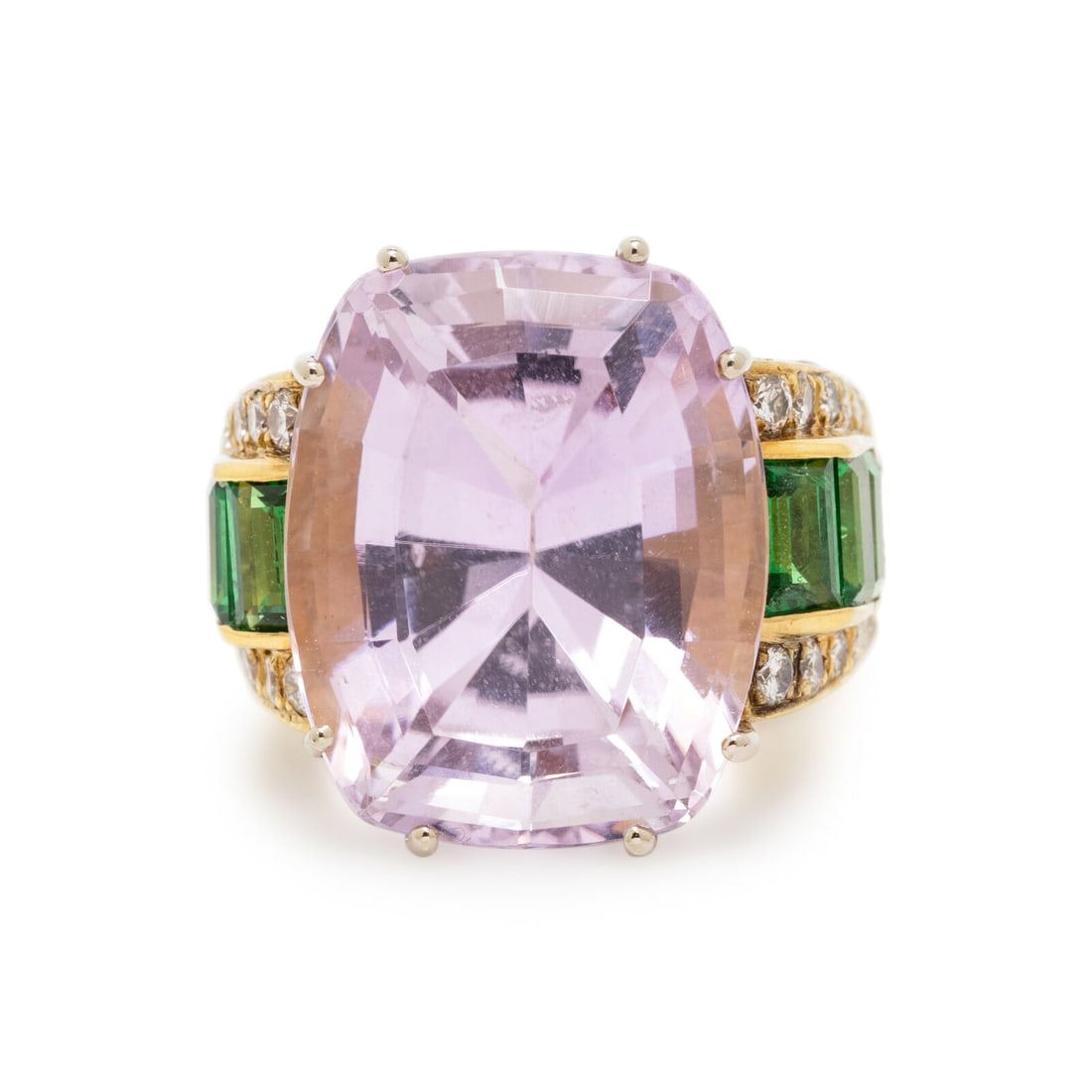 KUNZITE, TSAVORITE GARNET, DIAMOND, AND YELLOW GOLD RING: KUNZITE, TSAVORITE GARNET, DIAMOND, AND YELLOW GOLD RING Cushion cut kunzite weighing approximately 22.00 carats total, baguette cut tsavorite garnets, and round diamonds. 18 karat yellow gold. Ring s