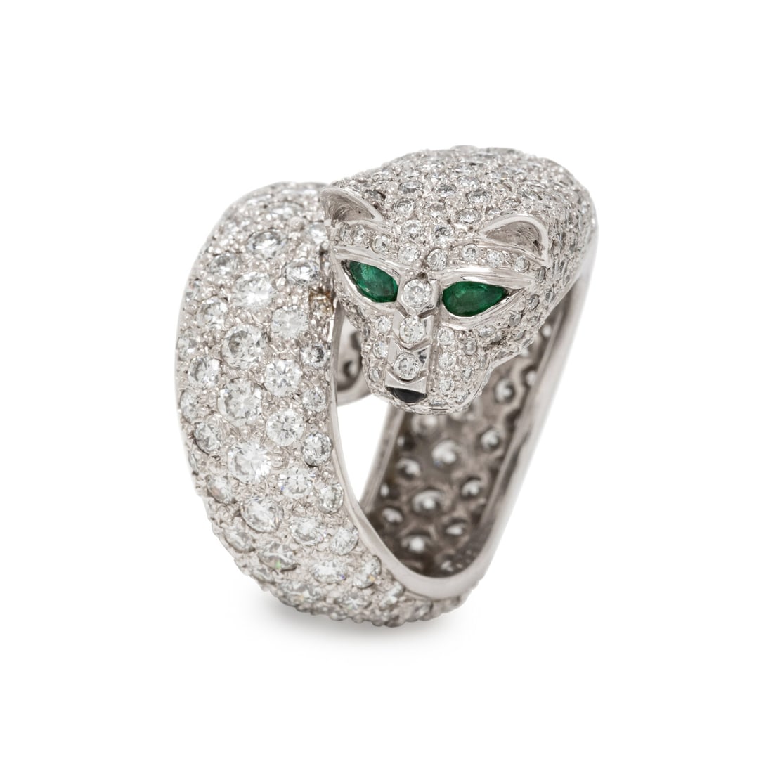 WHITE GOLD AND DIAMOND BYPASS PANTHER RING: WHITE GOLD AND DIAMOND BYPASS PANTHER RING Round diamonds weighing approximately 5.50 - 7.00 carats total, a black onyx nose, and pear shape emerald eyes. White gold. Ring size 5. Gross weight: 11.10