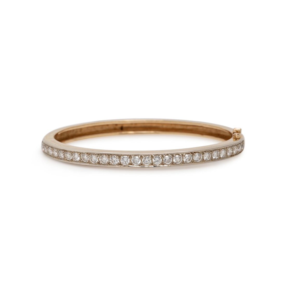 DIAMOND AND YELLOW GOLD BANGLE BRACELET: DIAMOND AND YELLOW GOLD BANGLE BRACELET Round diamonds weighing approximately 1.95 carats total, hinged with side clasp. 14 karat yellow gold. 6 1/4 inches inner circumference. Stamp: 14K. Gross weigh