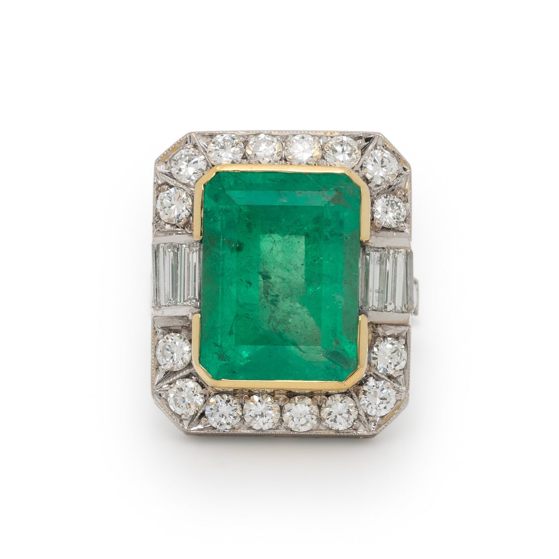EMERALD AND DIAMOND RING: EMERALD AND DIAMOND RING Emerald cut emerald weighing approximately 8.60 carats by formula, and round and baguette cut diamonds weighing approximately 2.50 carats total. 18 karat white and yellow gold