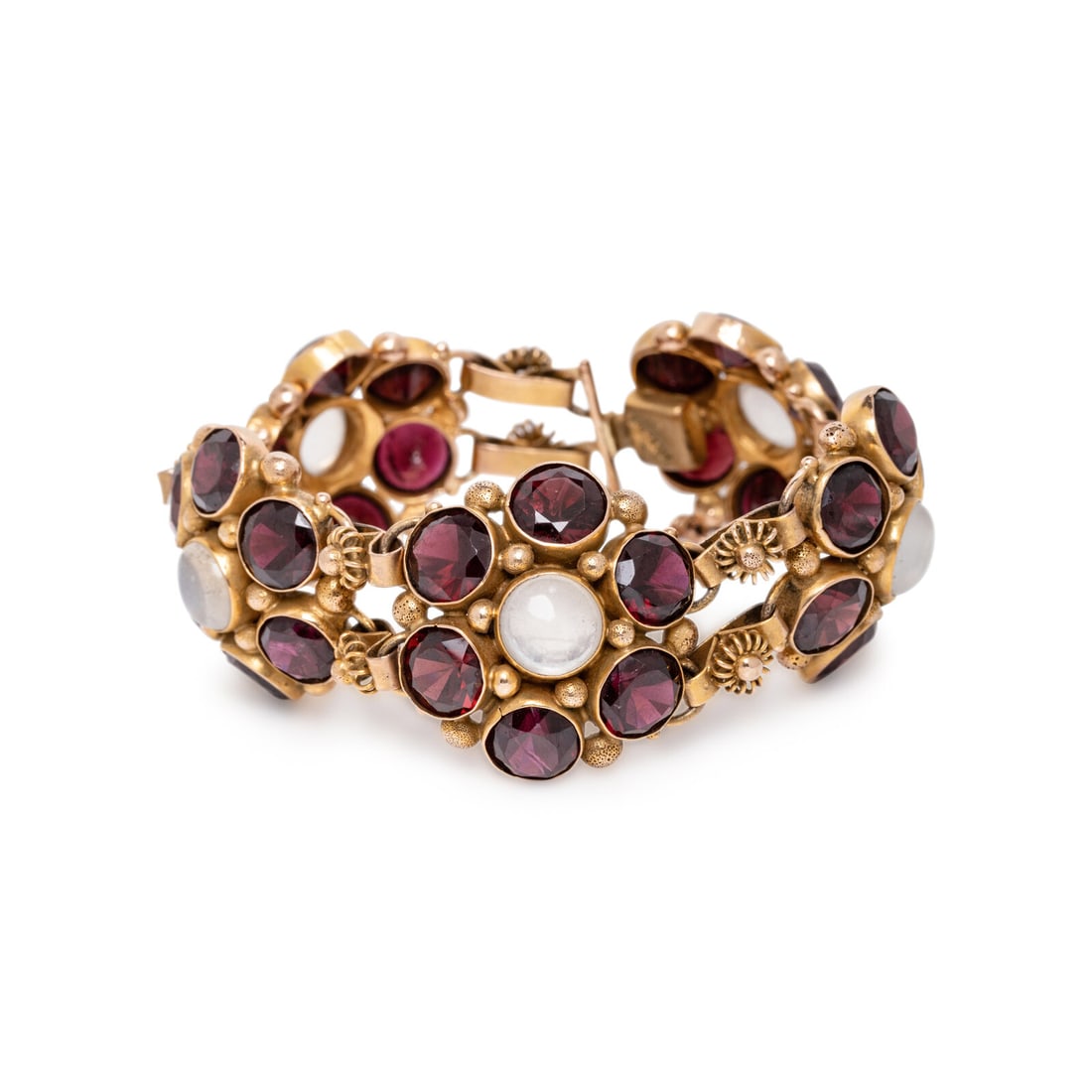 GARNET, MOONSTONE, AND YELLOW GOLD BRACELET: GARNET, MOONSTONE, AND YELLOW GOLD BRACELET Round cabochon moonstones and round garnets. Yellow gold. 6 1/2 inches long. Stamp: (partially obscured) SLOV. Gross weight: 36.35 dwt. Property from the Es