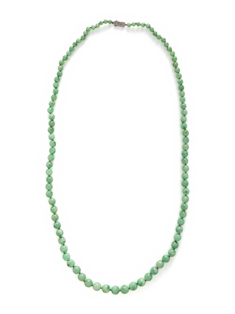 JADE BEADED NECKLACE: JADE BEADED NECKLACE Graduating jade beads measuring approximately 4.50 - 9.50 mm with a 14 karat white gold clasp. 29 inches long. Stamp: 14K. Gross weight: 41.65 dwt. This lot is located in Chicago.