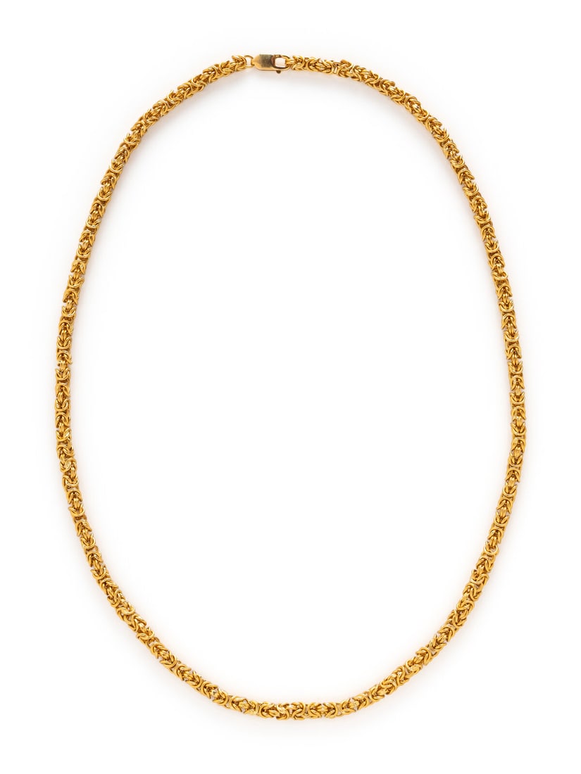 YELLOW GOLD BYZANTINE CHAIN NECKLACE: YELLOW GOLD BYZANTINE CHAIN NECKLACE In a byzantine link design. Yellow gold. 26 1/8 inches long. Gross weight: 90.80 dwt. This lot is located in Chicago.