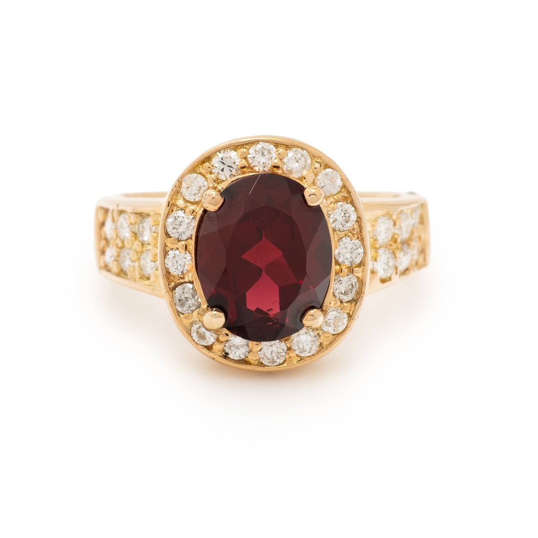 GARNET AND DIAMOND RING: GARNET AND DIAMOND RING Oval garnet weighing approximately 3.00 carats by formula, and round diamonds weighing approximately 0.75 carat total. Yellow gold. Ring size 7 1/4. Stamp: (obscured). Gross we