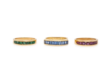 COLLECTION OF THREE RUBY, EMERALD, SAPPHIRE, AND YELLOW GOLD RINGS