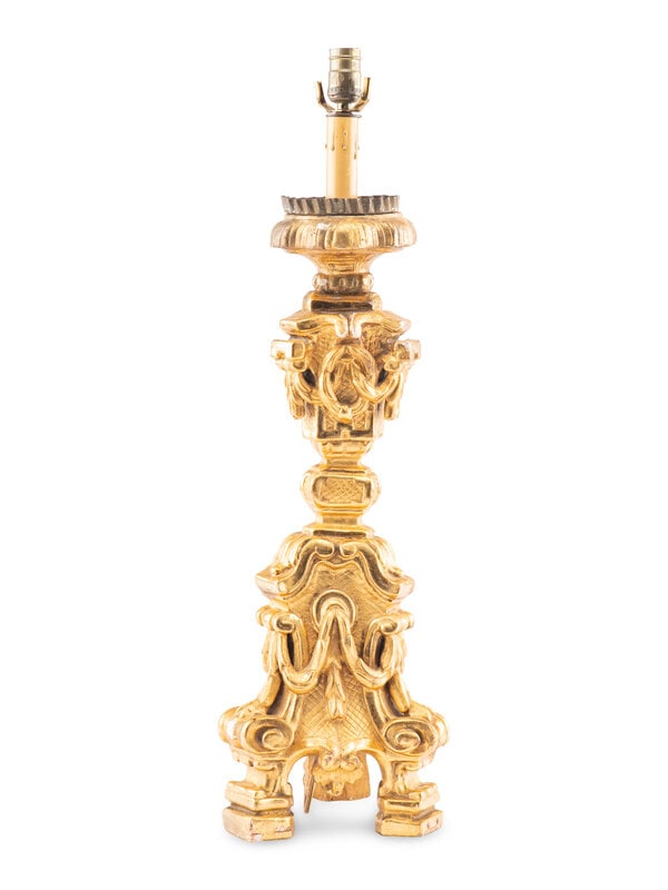 An Italian Giltwood Pricket Mounted as a Lamp: An Italian Giltwood Pricket Mounted as a Lamp Height (to base of lightbulb) 32 inches. Property from a Main Line Philadelphia Private Collector, with Interiors Designed by Willia