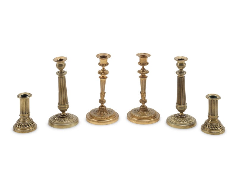 Three Pairs of French Gilt Bronze Candlesticks: Three Pairs of French Gilt Bronze Candlesticks 19th Century Height 8 inches. This lot is located in Chicago.