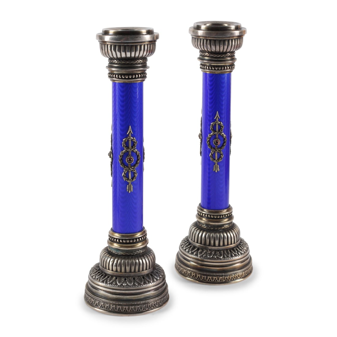A Pair of Silver, Guilloché Enamel and Gemstone Mounted Candlesticks: A Pair of Silver, Guilloché Enamel and Gemstone Mounted Candlesticks 20th Century each with rubbed marks on underside 12 ozt 5 dwt gross Height 6 3/4 inches. This lot is located in Chicago.
