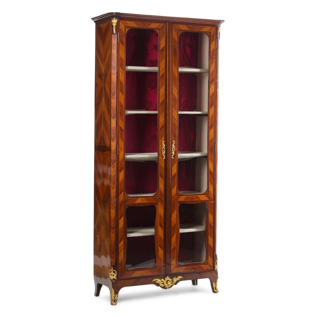 A Louis XV Gilt Bronze Mounted and Bookmatch-Veneer Vitrine Cabinet: A Louis XV Gilt Bronze Mounted and Bookmatch-Veneer Vitrine Cabinet By Antoine-Pierre Jacot, Third Quarter 18th Century the backboards stamped for maker. Height 89 x width 40 x depth 16 inches. This l