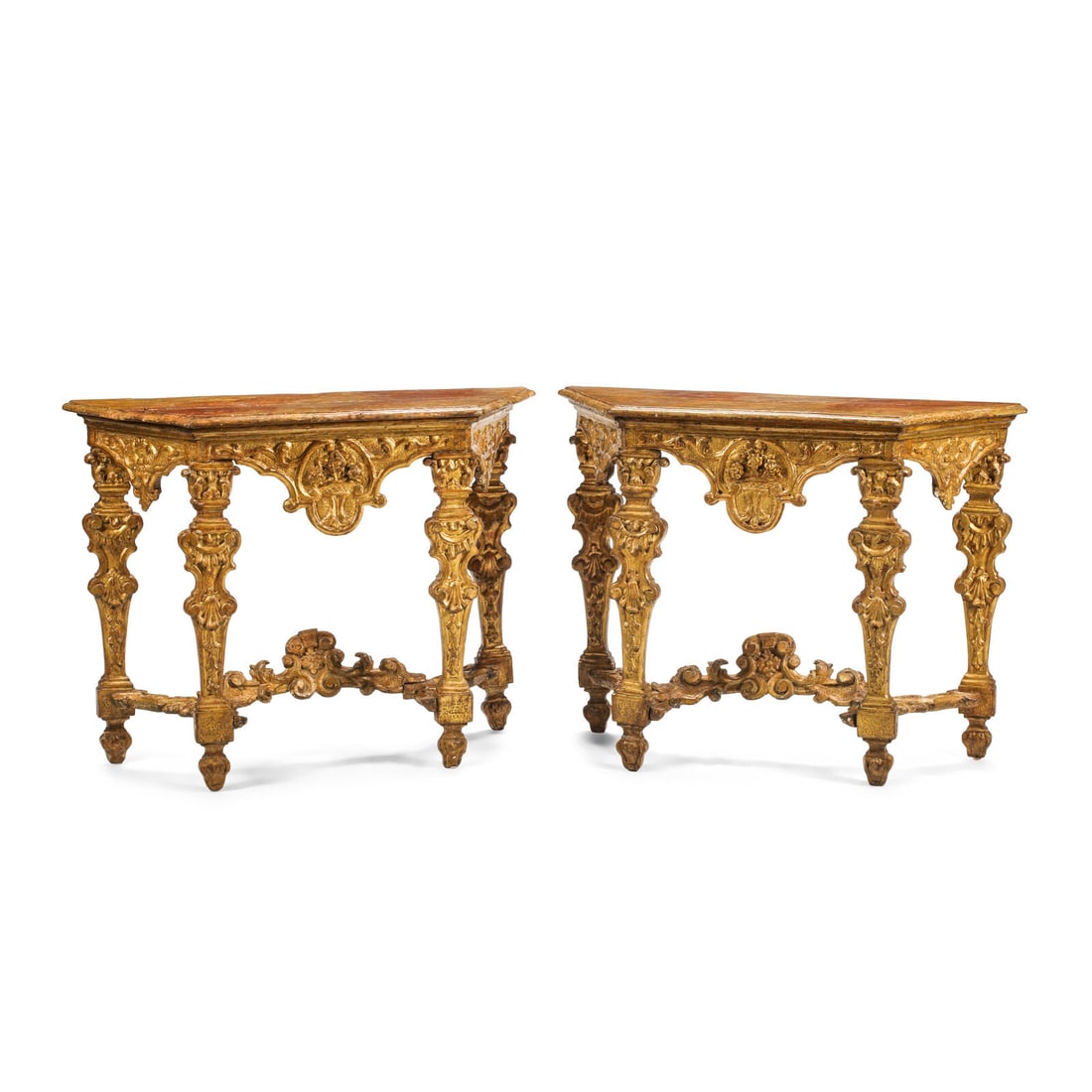 A Pair of Italian Baroque Carved Giltwood Console Tables: A Pair of Italian Baroque Carved Giltwood Console Tables 18th Century Height 33 x width 43 x depth 16 1/2 inches. This lot is located in Chicago.