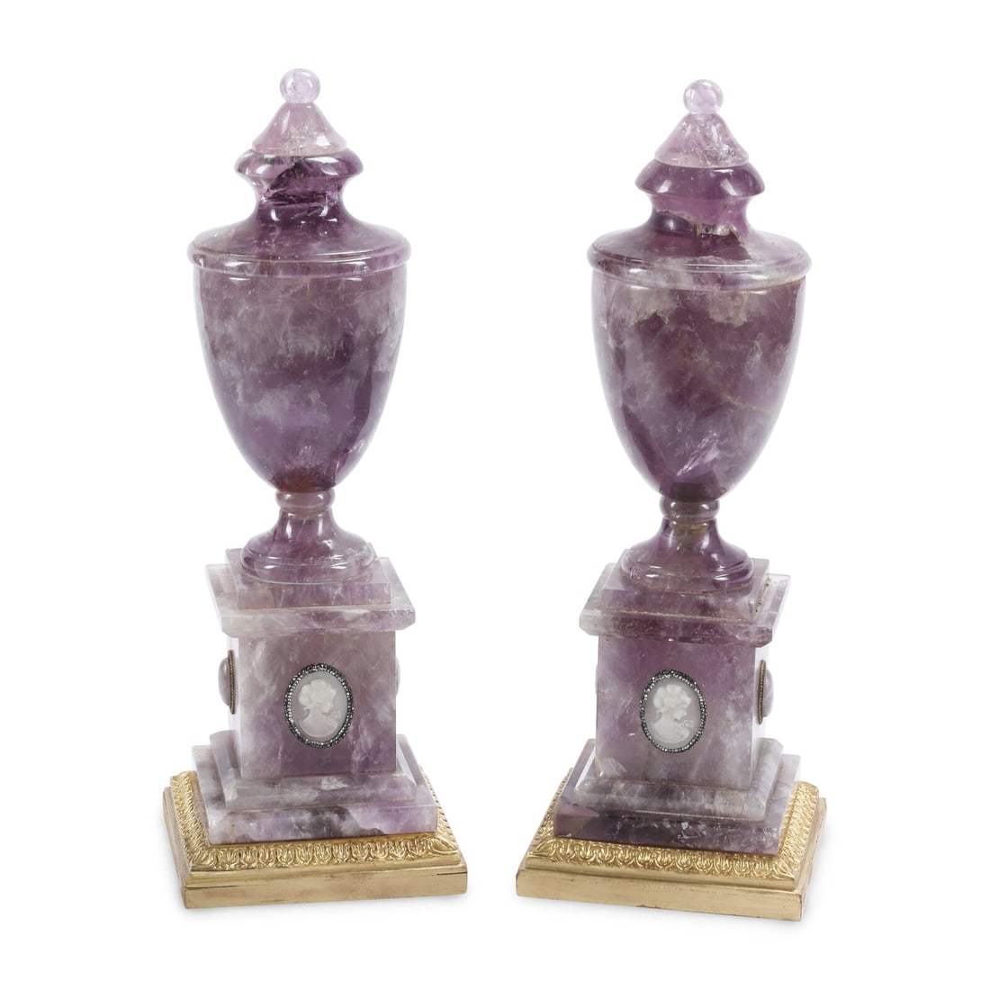 A Pair of Jeweled Amethyst Urns on Giltwood Bases: A Pair of Jeweled Amethyst Urns on Giltwood Bases 20th Century Height 16 x width 5 1/2 x depth 5 1/2 inches. This lot is located in Chicago.
