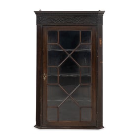 A George III Fret-Carved Mahogany Hanging Corner Cupboard
