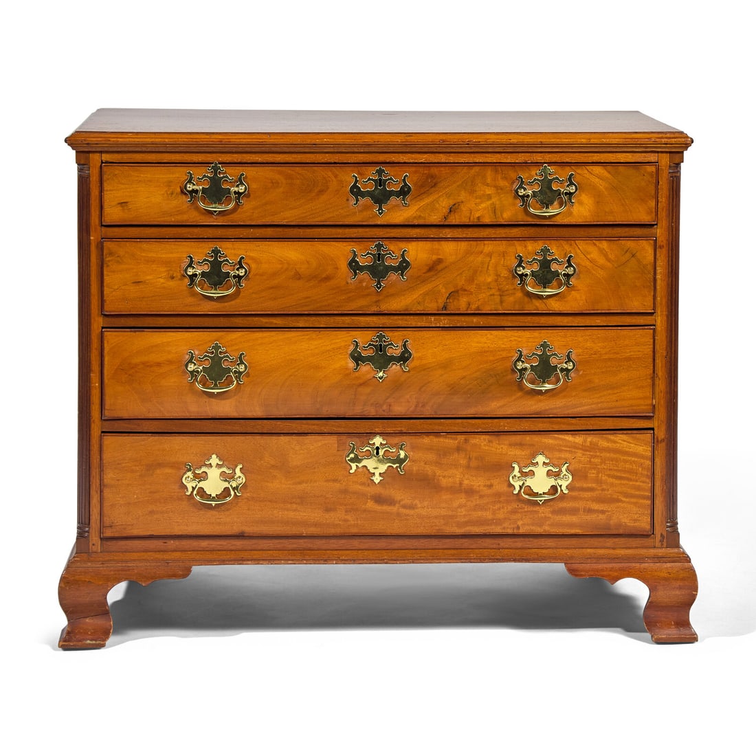 A Chippendale Mahogany Chest of Drawers: A Chippendale Mahogany Chest of Drawers Philadelphia, Pennsylvania, Circa 1760-1780 with molded top, over four graduated long drawers, flanked by quarter columns, on molded base with ogee feet. Height