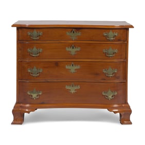 A Chippendale Cherry Oxbow Chest of Drawers