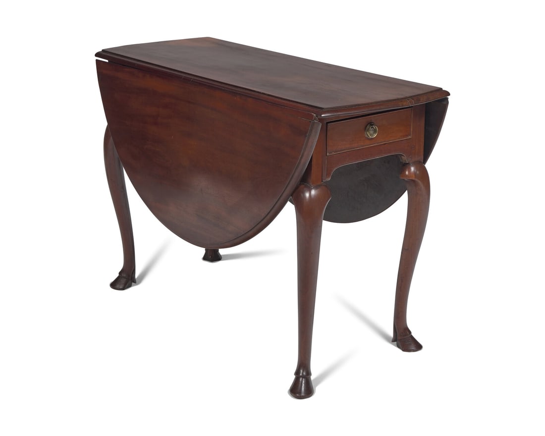 An Irish George II Mahogany Oval Drop-Leaf Table: An Irish George II Mahogany Oval Drop-Leaf Table Circa 1750 with end drawers, on cabriole legs and hoof feet. Height 28 3/4 x width 42 x depth 17 inches (when closed), depth 49 3/4 inches (when opened