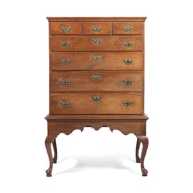 A Queen Anne Carved Walnut Chest-on-Frame