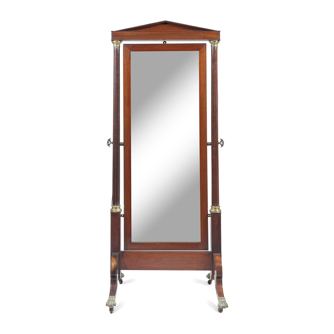A Regency Mahogany and Brass-Inlaid Cheval Mirror: A Regency Mahogany and Brass-Inlaid Cheval Mirror Circa 1825 with pedimented top, on brass paw-form feet with casters. Height 76 1/4 x width 30 1/4 x depth 24 1/2 inches. Height 26 in. Property from t
