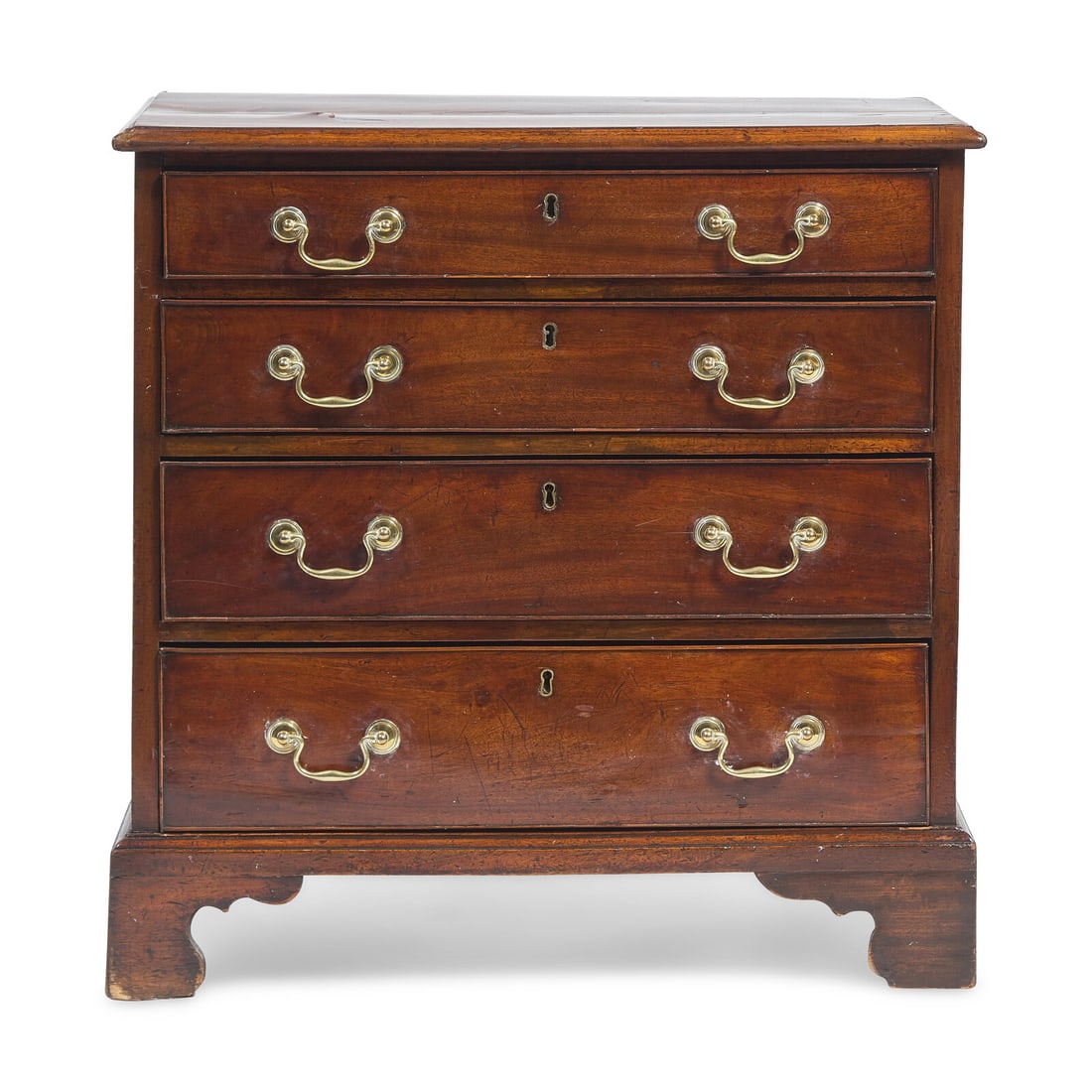 A George III Mahogany Butler's Chest of Drawers: A George III Mahogany Butler's Chest of Drawers Late 18th Century with rectangular molded top, over four graduated drawers with cock-beading, on molded base with bracket feet. Height 32 x width 31 1/2