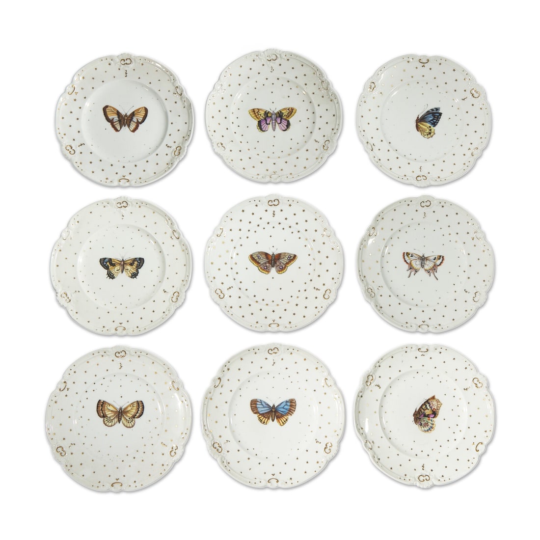 A Set of Nine Paris Porcelain Butterfly Plates: A Set of Nine Paris Porcelain Butterfly Plates 19th Century each decorated with gilt stars and hand-painted with various butterflies, apparently unmarked. Diameter 9 inches. This lot is located in Phi