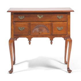 A Queen Anne Fan-Carved Cherrywood Pad-Foot Dressing Table