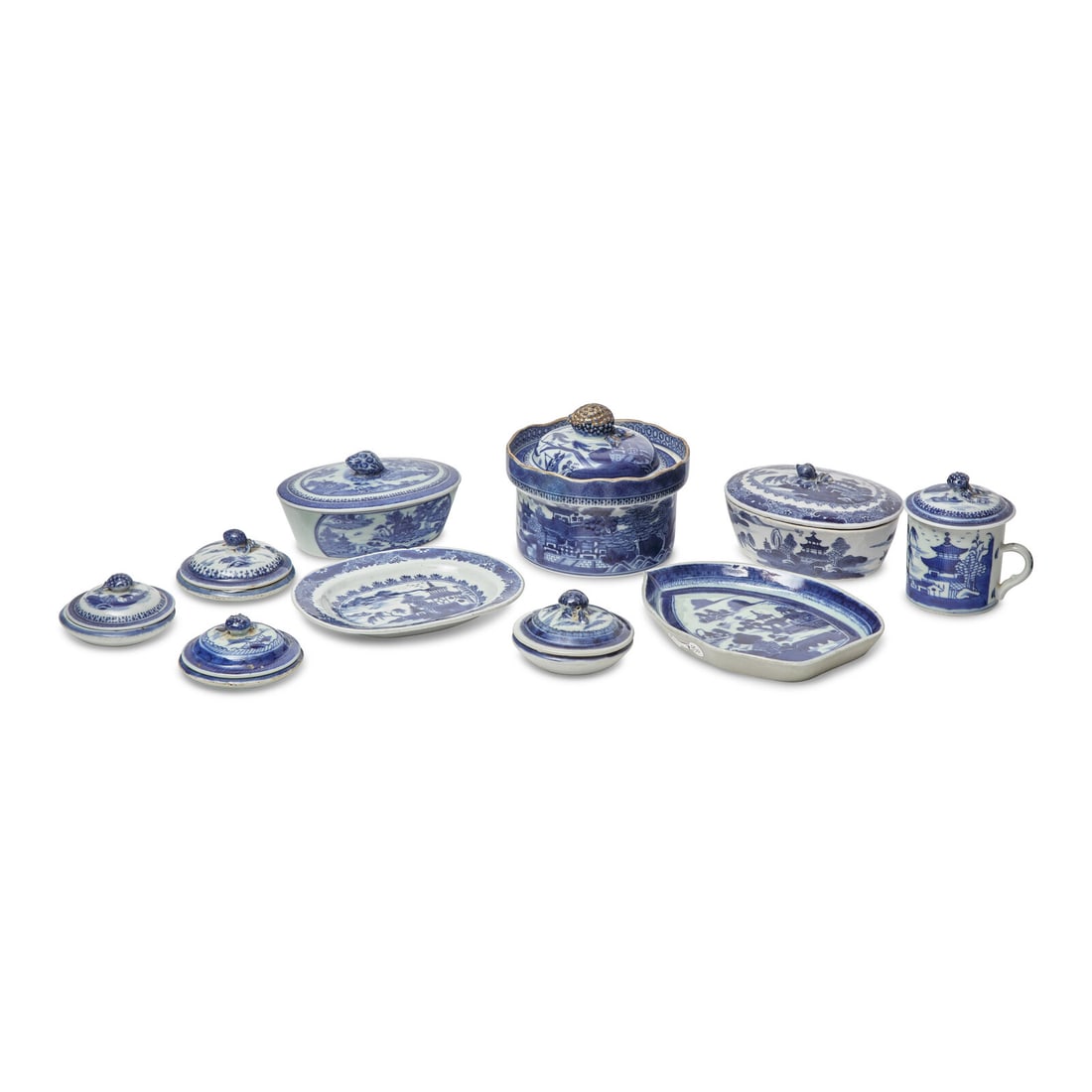 A Group of Fourteen Chinese Export Porcelain Nanking Tablewares: A Group of Fourteen Chinese Export Porcelain Nanking Tablewares Late 18th Century comprising three butter tubs and one butter tub stand, a sauce boat stand, a teacup, four butter pats, and five lids.