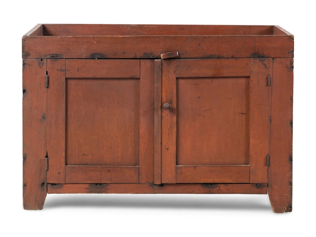 A Red-Painted Dry Sink: A Red-Painted Dry Sink Kentucky, Circa 1830 with two paneled doors revealing storage shelves. Height 29 x width 43 5/8 x depth 19 3/4 inches. Property from an Atlanta Collection This lot is