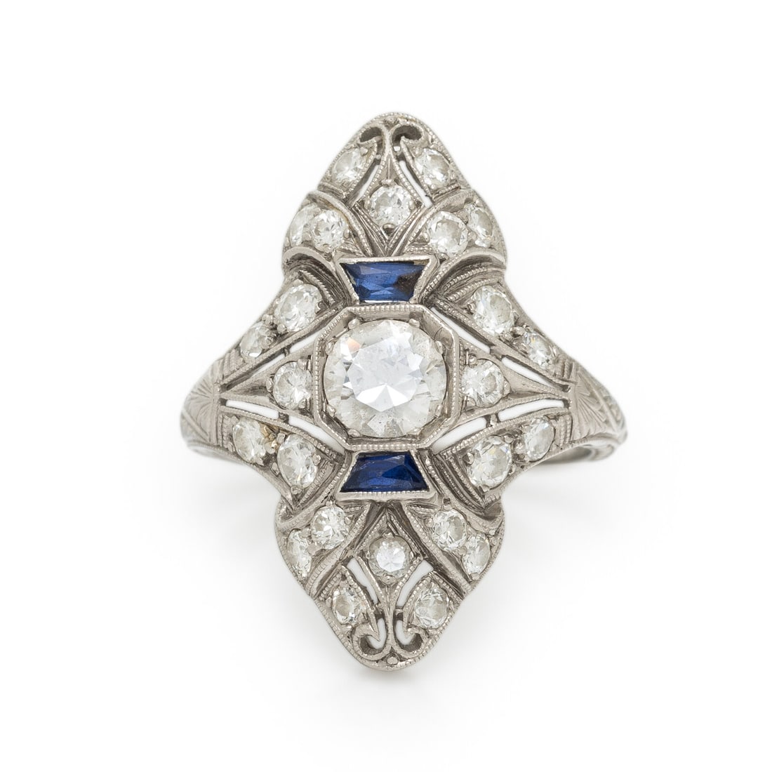 ART DECO, DIAMOND AND PLATINUM NAVETTE RING: ART DECO, DIAMOND AND PLATINUM NAVETTE RING Center transitional cut diamond weighing approximately 0.60 carat, transitional cut diamonds weighing approximately 0.35 carat total, and French cut