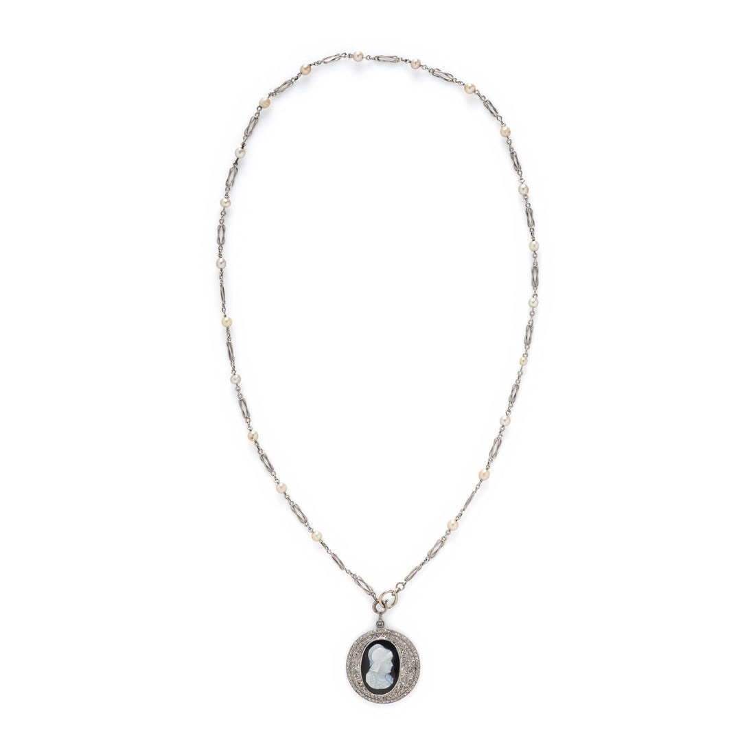CAMEO, DIAMOND, AND SEED PEARL PENDANT NECKLACE: CAMEO, DIAMOND, AND SEED PEARL PENDANT NECKLACE Oval onyx cameo measuring approximately 19.30 x 13.20 mm, rose cut diamonds, and seed pearls. Platinum and white gold. Chain: 19 inches long. Pendant: