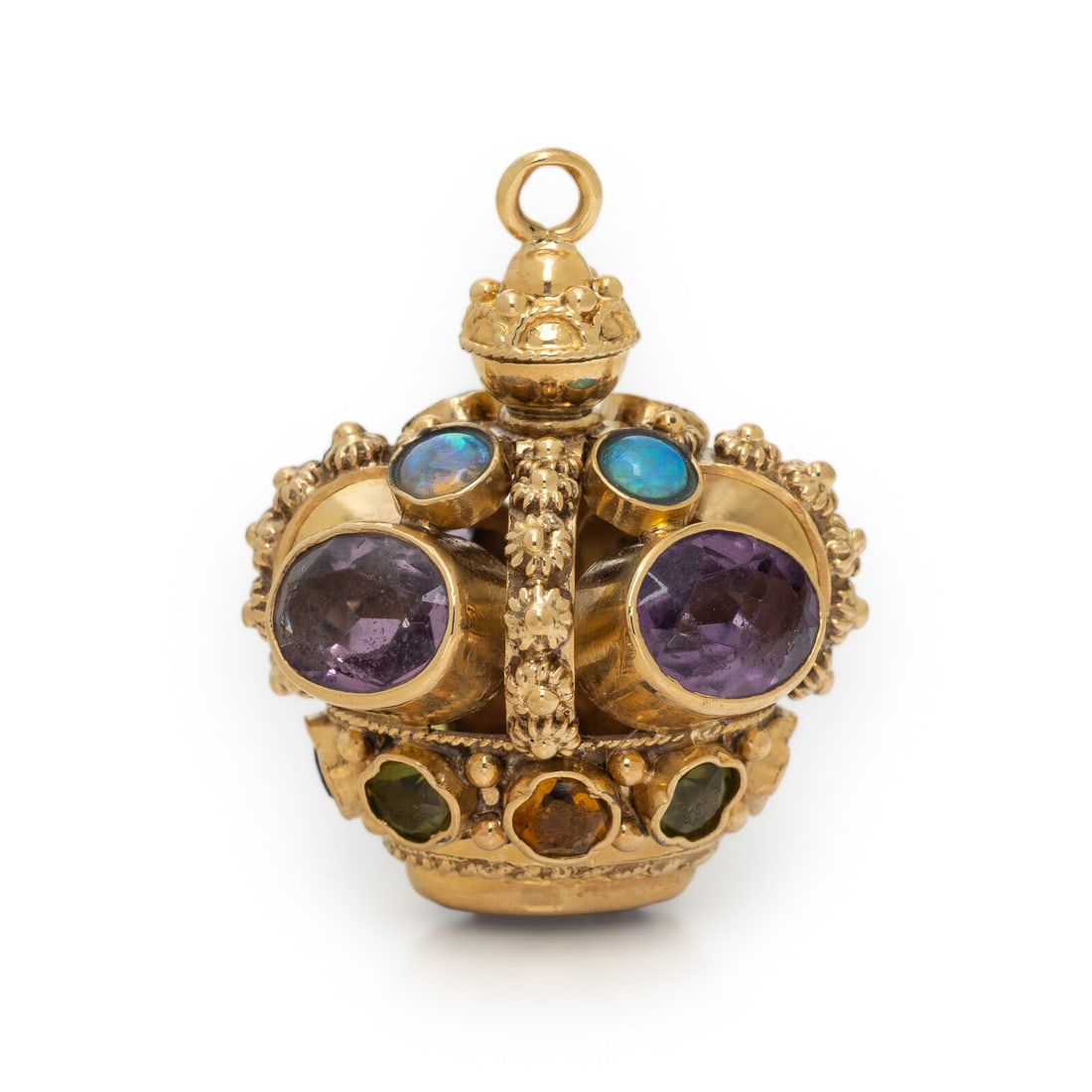 MULTIGEM AND YELLOW GOLD CROWN PENDANT: MULTIGEM AND YELLOW GOLD CROWN PENDANT Oval amethyst, round cabochon opal, and modified cushion cut peridot, citrine, and amethyst. Yellow gold. 1 1/8 x 7/8 inch. Gross weight: 9.25 dwt. Property of
