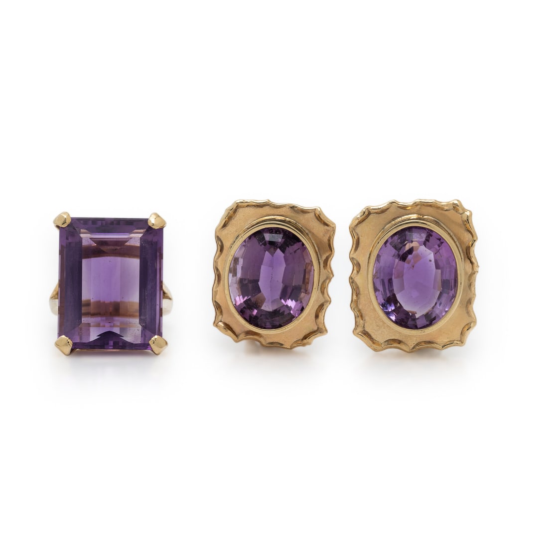 AMETHYST AND YELLOW GOLD EARRINGS AND RING: AMETHYST AND YELLOW GOLD EARRINGS AND RING Including a pair of earrings set with oval amethysts and a ring set with an emerald cut amethyst measuring approximately 20.80 x 16.25 x 8.65 mm. 14 karat