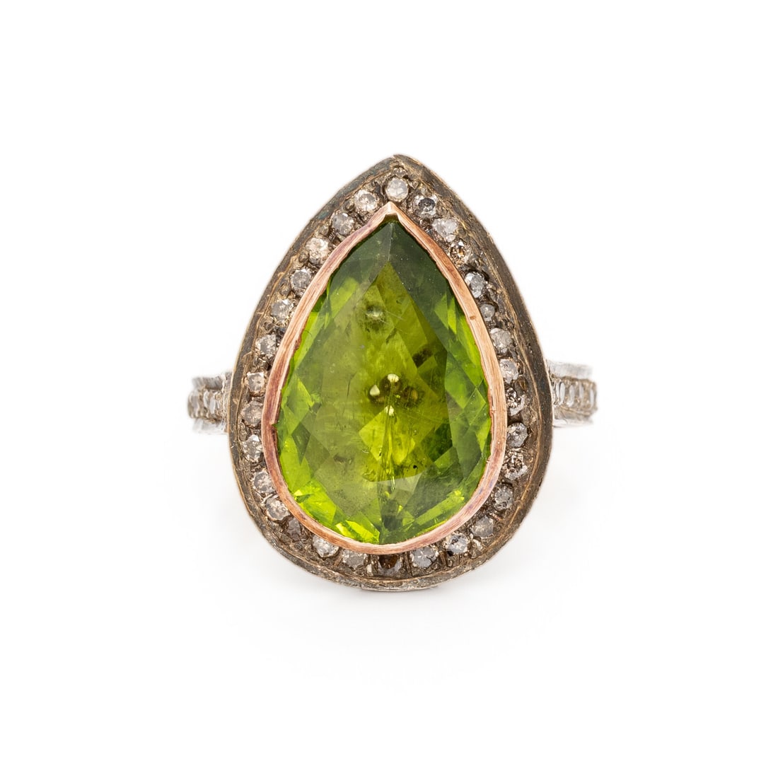 PERIDOT AND COLORED DIAMOND RING: PERIDOT AND COLORED DIAMOND RING Pear shape peridot measuring approximately 16.20 x 10.75 mm and pavé-set round brown diamonds (origin of color not tested) weighing approximately 1.10 carats