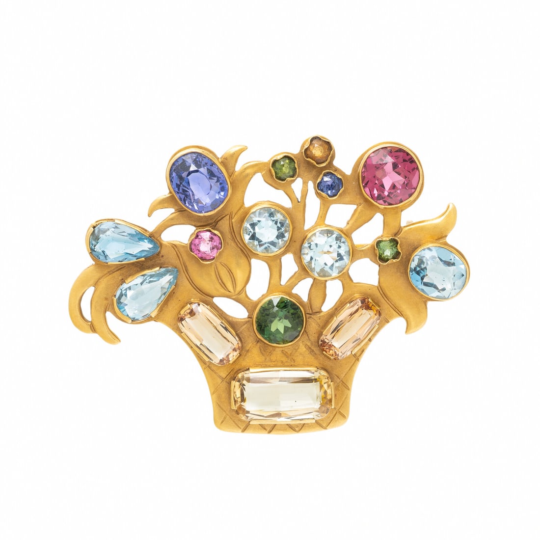 YELLOW GOLD AND MULTIGEM BROOCH: YELLOW GOLD AND MULTIGEM BROOCH Variously cut colored gemstones including topaz, pink tourmaline, aquamarine, sapphire, and peridot. 18 karat yellow gold. 1 7/8 x 1 3/8 inches. Stamp: 18K. Gross