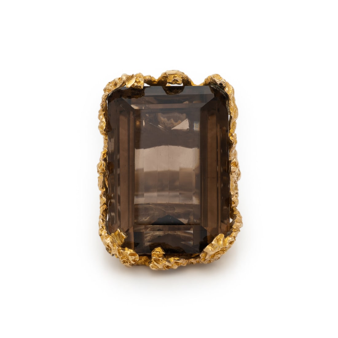 SMOKY QUARTZ AND YELLOW GOLD RING: SMOKY QUARTZ AND YELLOW GOLD RING Rectangular step cut smoky quartz weighing approximately 69.00 carats by formula. Yellow gold. Ring size 7 3/4. Gross weight: 27.10 dwt. Property of a Private