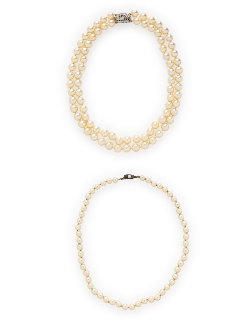 TWO CULTURED PEARL NECKLACES: TWO CULTURED PEARL NECKLACES Including a double strand necklace with cultured pearls measuring approximately 8.30 - 8.75 mm with a clasp set with round and marquise cut diamonds weighing approximately