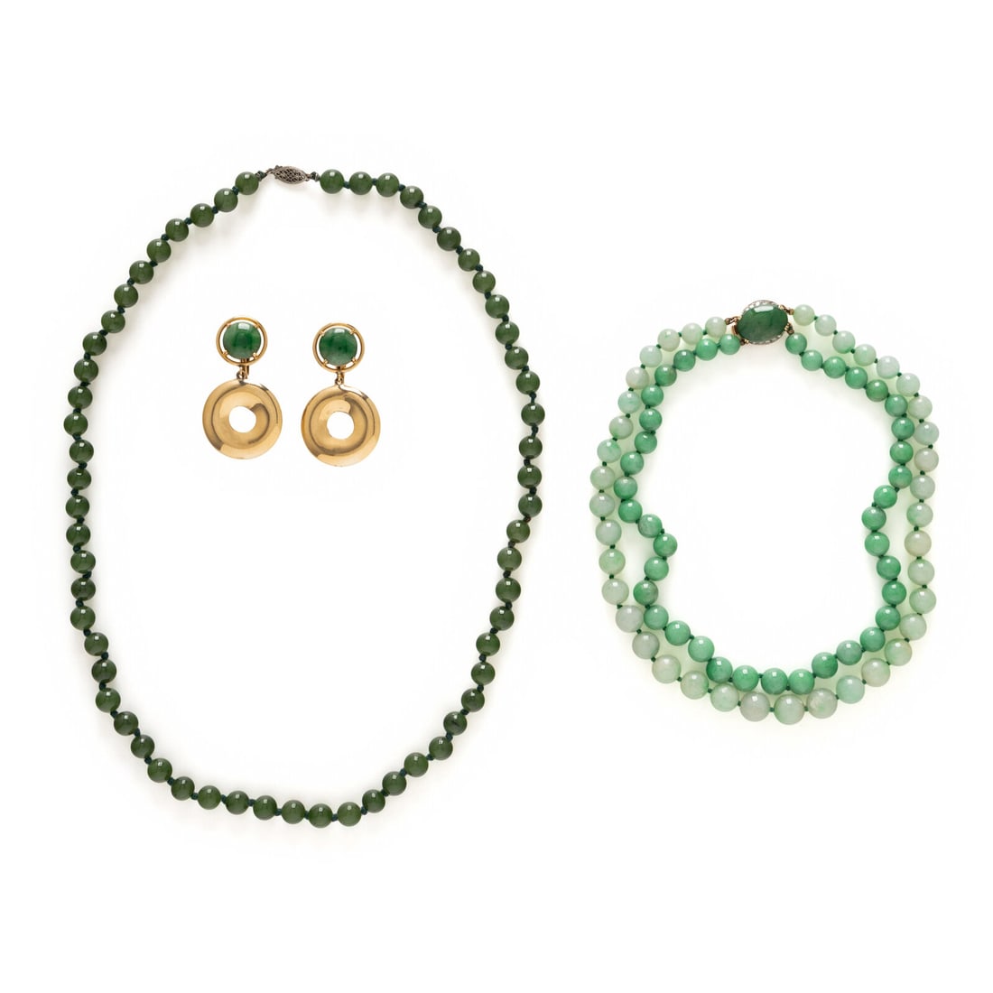 COLLECTION OF JADE JEWELRY: COLLECTION OF JADE JEWELRY Including a double-strand jade beaded necklace finished with an oval cabochon jade and round diamond-set clasp, a single-strand jade beaded necklace, and a pair of earrings