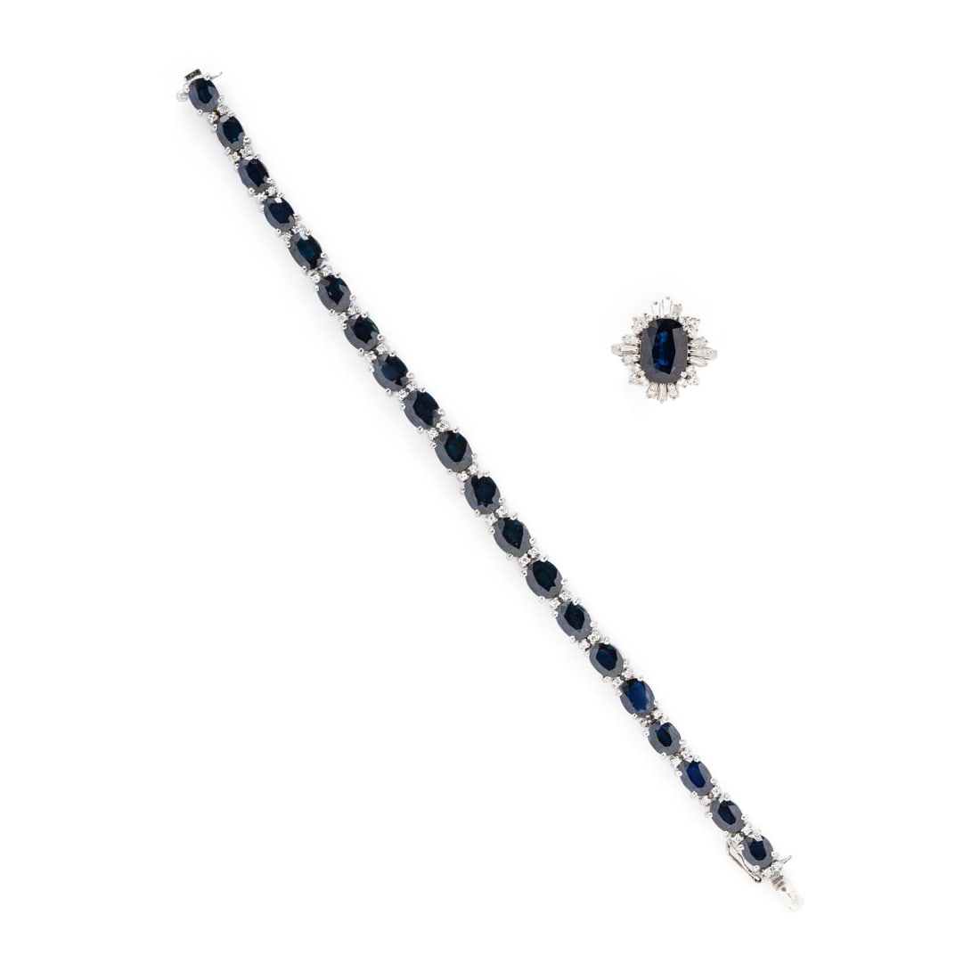 SAPPHIRE AND DIAMOND AND BRACELET AND RING: SAPPHIRE AND DIAMOND AND BRACELET AND RING Including a bracelet and a ring set with oval cut sapphires, and round and tapered baguette cut diamonds weighing approximately 1.25 carats total. Silver