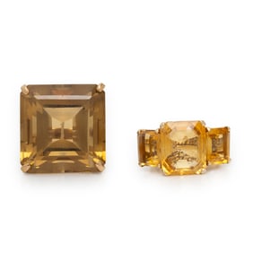 TWO CITRINE AND YELLOW GOLD RINGS